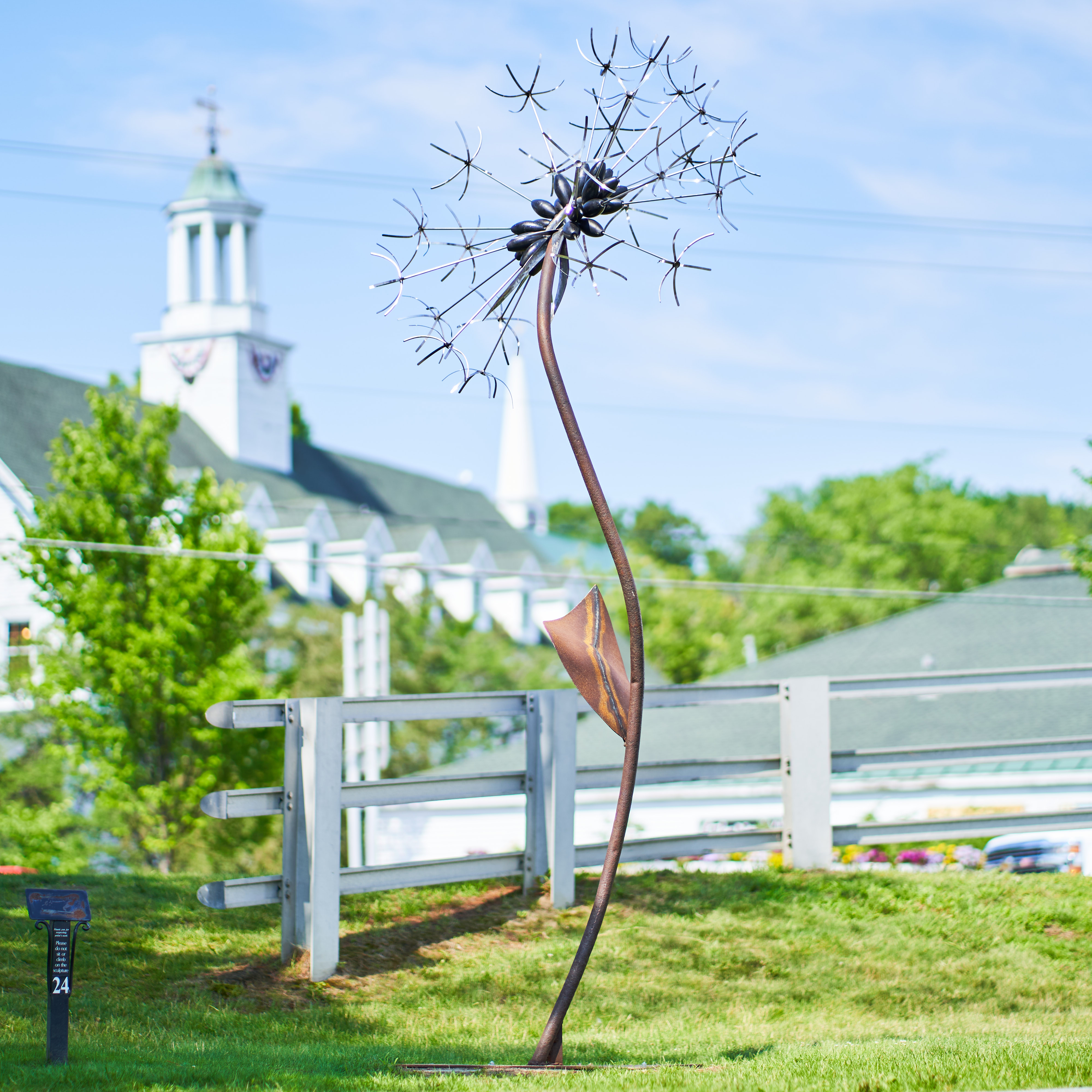 Massive sculpture of a dandelion, stainless steel.