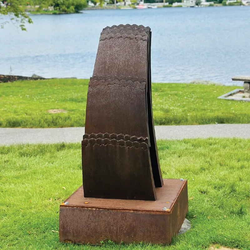 A photo of the sculpture "Out of the Earth" by Gary Rathmell